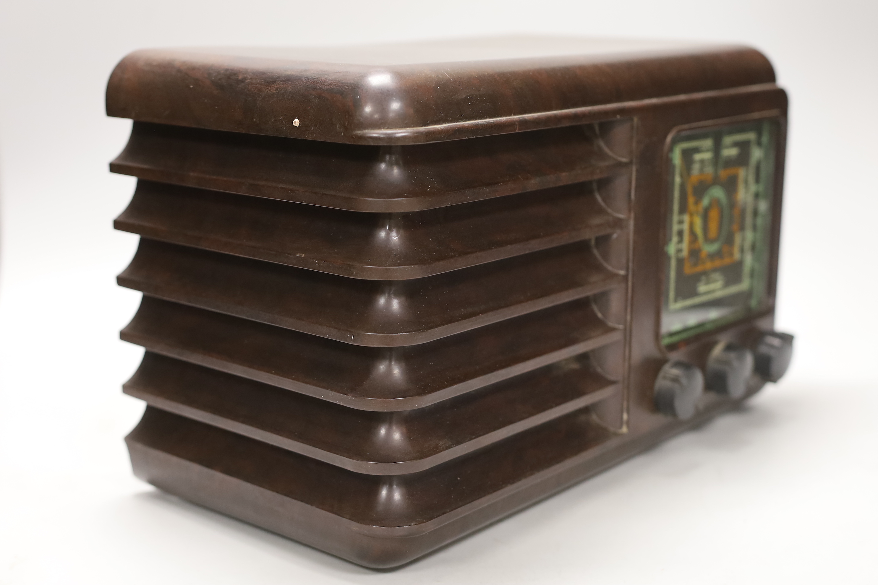 An Art Deco style brown Bakelite Westminster radio, 37cm wide